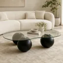 Mesa de centro ORBIT com tampo orgânico em vidro e bases esféricas